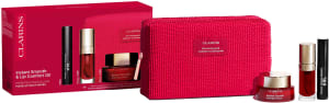 CLARINS סט קרם אינסטנט סמות' +  ליפ אויל גוון 03 + מסקרה XXL + תיק איפור
